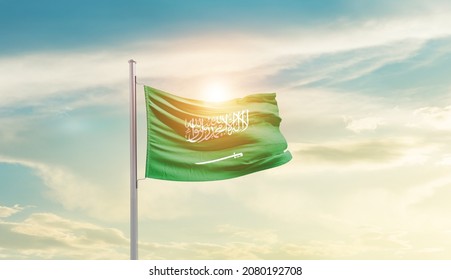 Saudi Arabia National Flag Waving In Beautiful Sky.