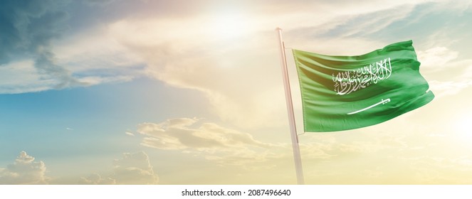 Saudi Arabia National Flag Waving In Beautiful Sky.