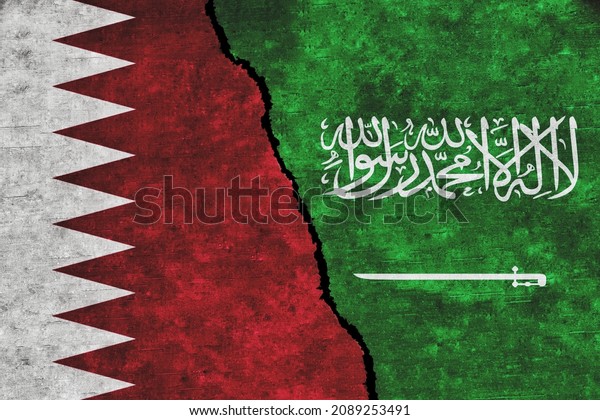 Saudi Arabia and Qatar painted flags on a wall\
with a crack. Saudi Arabia and Qatar conflict. Qatar and Saudi\
Arabia relations. Saudi Arabia vs\
Qatar