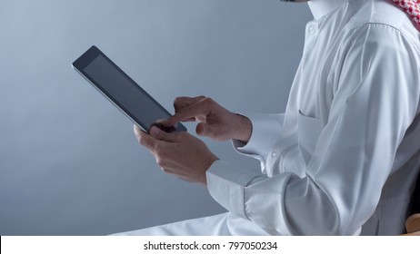 Saudi Arabian Man Hands Holding And Using Tablet