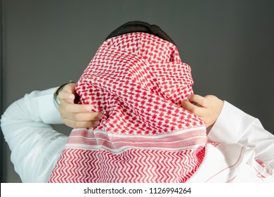 Saudi Arabian Man Wears Traditional Saudi Clothes. Photograph Portrait From Behind.