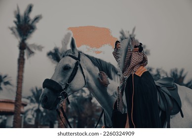 Saudi Foundation Day, the national day of the Kingdom of KSA, A Saudi man riding a horse and carrying a Saudi warrior's sword
Saudi heritage History of the Kingdom of KSA - Shutterstock ID 2260324909