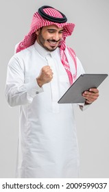 Saudi Man Holding A Tablet