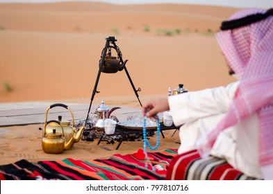 Saudi Man Sitting In Desert  (Bar)