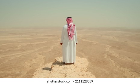 saudi man standing in mountain 