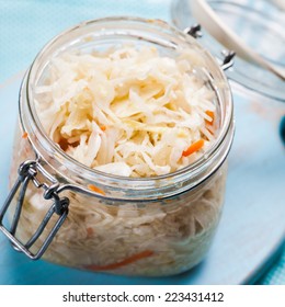 Sauerkraut In A Glass Jar On The Table