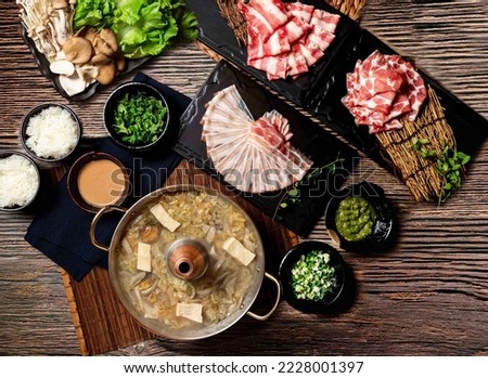 Sauerkraut White Meat Pot Bottom Set with Exclusive, US PRIME Beef Ribs, chopsticks served in pot isolated on table top view of taiwan food