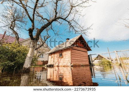 Sauna bath building In Water During Spring Flood floodwaters during natural disaster. Water deluge During A Spring Flood. inundation River.