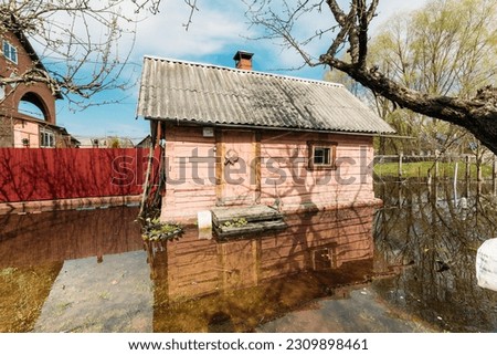 Sauna bath building In Water During Spring Flood floodwaters during natural disaster. Water deluge During A Spring Flood. inundation River.