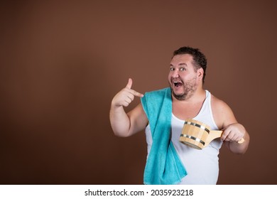 Sauna. Funny Fat Man. Brown Background.