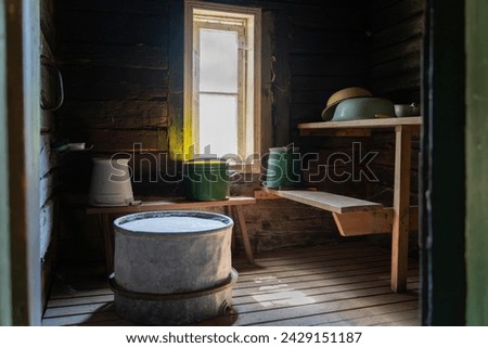 Sauna steam room. Wooden benches and accessories for sauna. Interior of old sauna. 