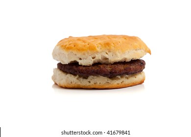 A Sausage Biscuit On A White Background