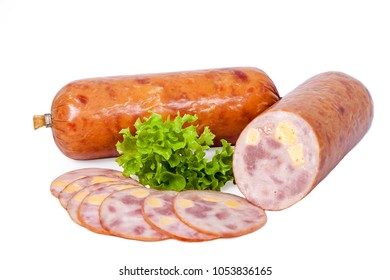 Sausage with cheese inside. Whole and partially sliced. Semi-smoked meat product decorated with a leaf of lettuce. Isolated on white background