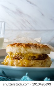 Sausage Egg And Cheese Biscuit Breakfast Sandwich With Glass Of Milk