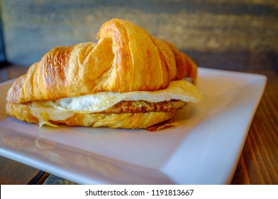 Sausage Egg And Cheese On Flaky French Croissant Roll