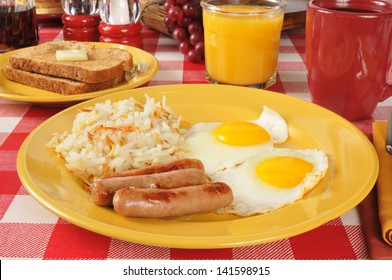 Sausage And Eggs With Hash Browns And Toast