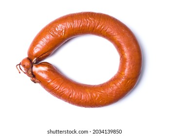 Sausage Ring On A White Background. Appetizing Raw Smoked Sausage. Studio Photography