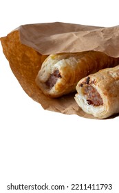 Sausage Rolls In A Brown Paper Bag, Environmentally Friendly Biodegradable Packaging. Isolated On A White Background