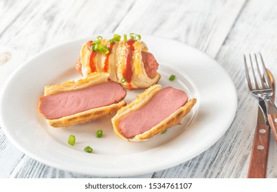 Sausage Rolls On The White Plate: Top View