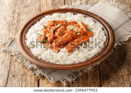 Sausage Stroganoff or korv stroganoff is a Swedish dish with sausage that is inspired by the dish Beef Stroganoff closeup on the plate on the table. Horizontal
