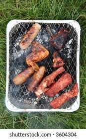 Sausages And Different Meats On The Disposable Bbq