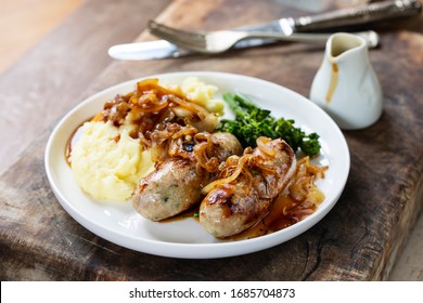 Sausages with fried onions and mashed potatoes