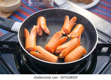 Sausages Grilled In A Small Black Pan In The Morning.  Easy And Simple Breakfast Recipes For A Busy Morning.  There Was A Bit Of Smoke Coming From The Pan.