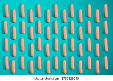 Sausages On A Blue Background. Sausage Patern. Minimal Junk Food Concept. Сoncept Of A Snack At Work, At School, Student Fast Food.