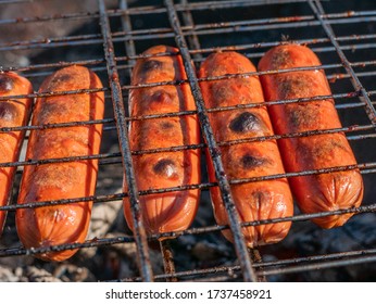 Sausages On The Grill. Fry Food. Burnt Sausages. Family Holiday.