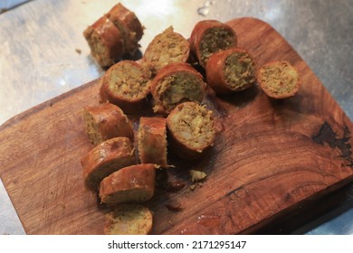 Sausages That Have Been Cut Into Small Pieces Are Placed On A Food Processor.