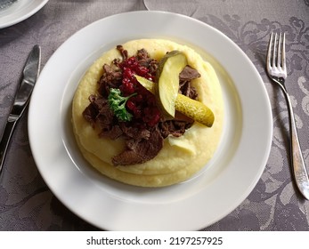 Sauteed Reindeer Meat Served With Mashed Potatoes And Lingonberry Sauce. 