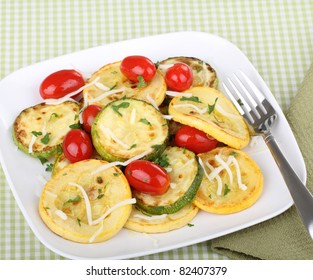 Sauteed Sliced Zucchini And Yellow Squash With Grape Tomatoes On A Plate