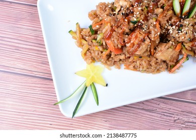 Sauteed Wok Rice, Accompanied By Beef Tenderloin, Vegetables, Chicken, Sesame, Soy Sauce And Teriyaki