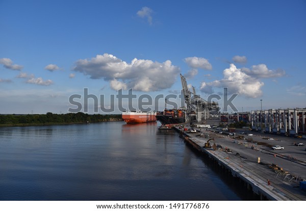 Savannah, Georgia / USA - August 07\
2019: Large car carrier ship arriving to the port of\
Savannah.
