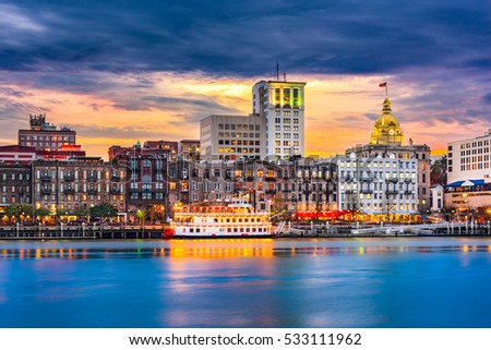 Savannah, Georgia, USA skyline on the Savannah River at dusk.