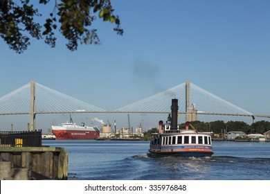 SAVANNAH, GEORGIA/USA - OCTOBER 23, 2014: Ferry boat taxi sails towards the Arthur Ravenel Jr. Bridge. Free of charge water taxis cross the Savannah river to Hutchinson Island.