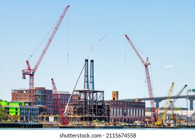 Savannah River Waterfront With Construction Development Site By Cranes, Brick Old Town Architecture In Savannah, Georgia Southern City With Road Bridge