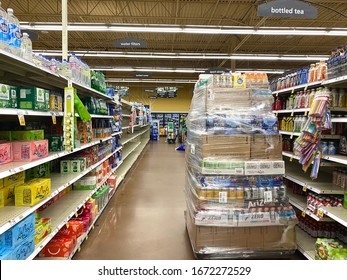 Savannah,Georgia/United States-Mar 14 2020: Inside Kroger Grocery Store ,Bottle Drinks Waiting To Be Put  On Partially Empty Shelf After US Declares National Emergency As COVID-19 Coronavirus Spreads.