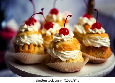 Savarin cake with cream and cherry - Powered by Shutterstock