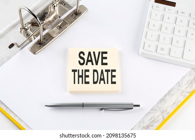 SAVE THE DATE - Business Concept, Message On Sticker On Folder Background With Calculator