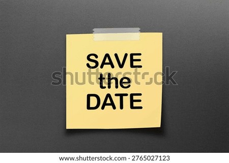Save the Date message on a yellow sticky note. 