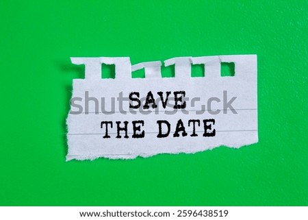 Save the date message written on ripped torn paper on green background. Conceptual save the date symbol. Copy space.