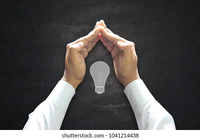 Save Energy Concept : Under Human Hands Protecting Position Over Chalkboard