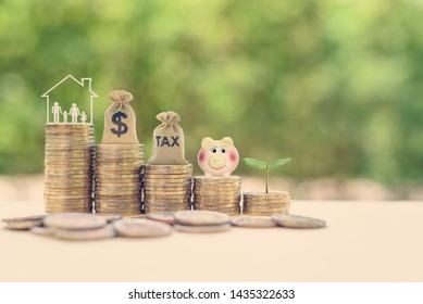 Save Income Tax And Tax Planning, Child Trust Fund Concept : Parents, Wife And Children In A Home Or House, US Dollar Bag, Tax Bag, Piggy Bank, Small Growing Tree On Rows Of Rising / Increasing Coins