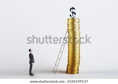 Save money and investment growth concept with businessman standing in front of ladder leaning against high golden coins stack and dollar sign on top