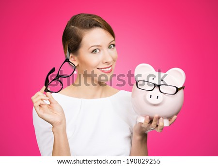 Save money on frames. Closeup portrait, headshot young excited, happy, smiling  business woman. Buying eyewear opportunity. Piggy bank wearing glasses isolated pink background. Facial expressions