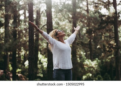 Save The Planet For A Clean And Green Better Future Concept - Caucasian People Young Woman Opening Arms In The Forest To Stop Deforestation And Help The World