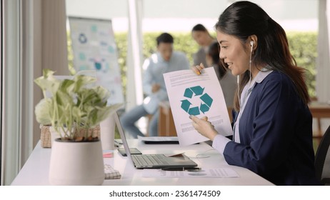 Save the planet earth of Future growth Net zero waste ESG office SME global protect CO2 emission social issues project. Young woman asia people teaching advice Eco friendly SDGs job on laptop seminar. - Powered by Shutterstock