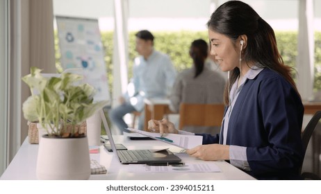 Save the planet earth of Future growth Net zero waste ESG office SME global protect CO2 emission social issues project. Young woman asia people teaching advice Eco friendly SDGs job on laptop seminar. - Powered by Shutterstock