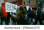 Save planet ecology protest outdoor. Activist person hold anti global warming banner. Eco demonstration placard. No climate change concept. City street picket background. World care rally Earth poster